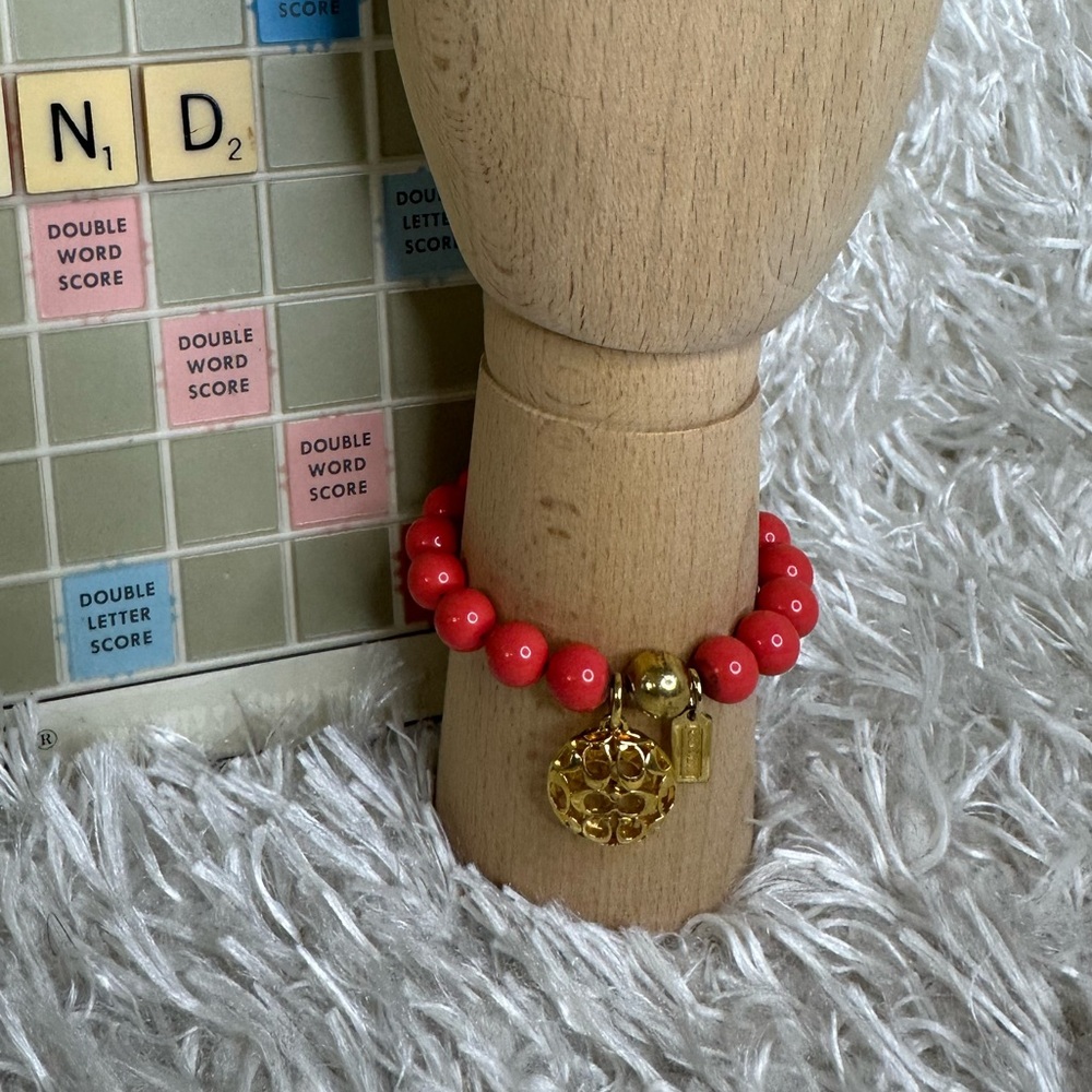 Coach Coral Beaded Bracelet with Gold Signature Charm